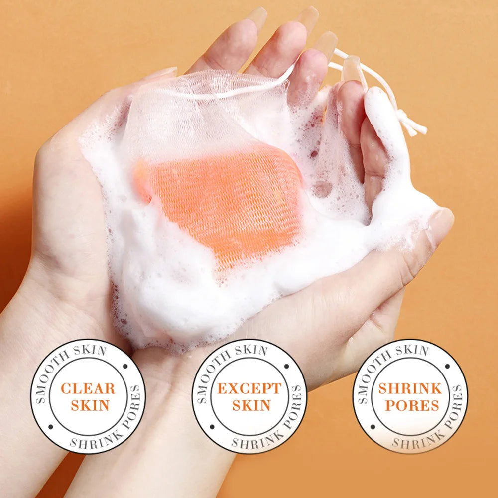 Hands holding foaming handmade turmeric soap for skin lightening with clear and smooth skin benefits