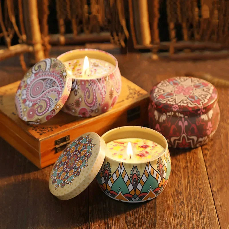 Islamic pattern scented candles in decorative tins with intricate colorful designs on wooden surface