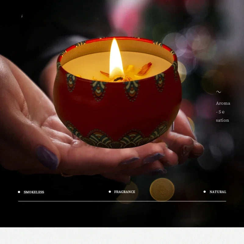 Hand holding a lit Islamic pattern scented candles in a red decorative holder emitting a warm glow
