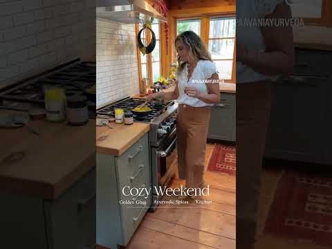 Woman cooking in kitchen using DC-PAAVANI Ayurveda tridoshic spice blend for flavorful meals