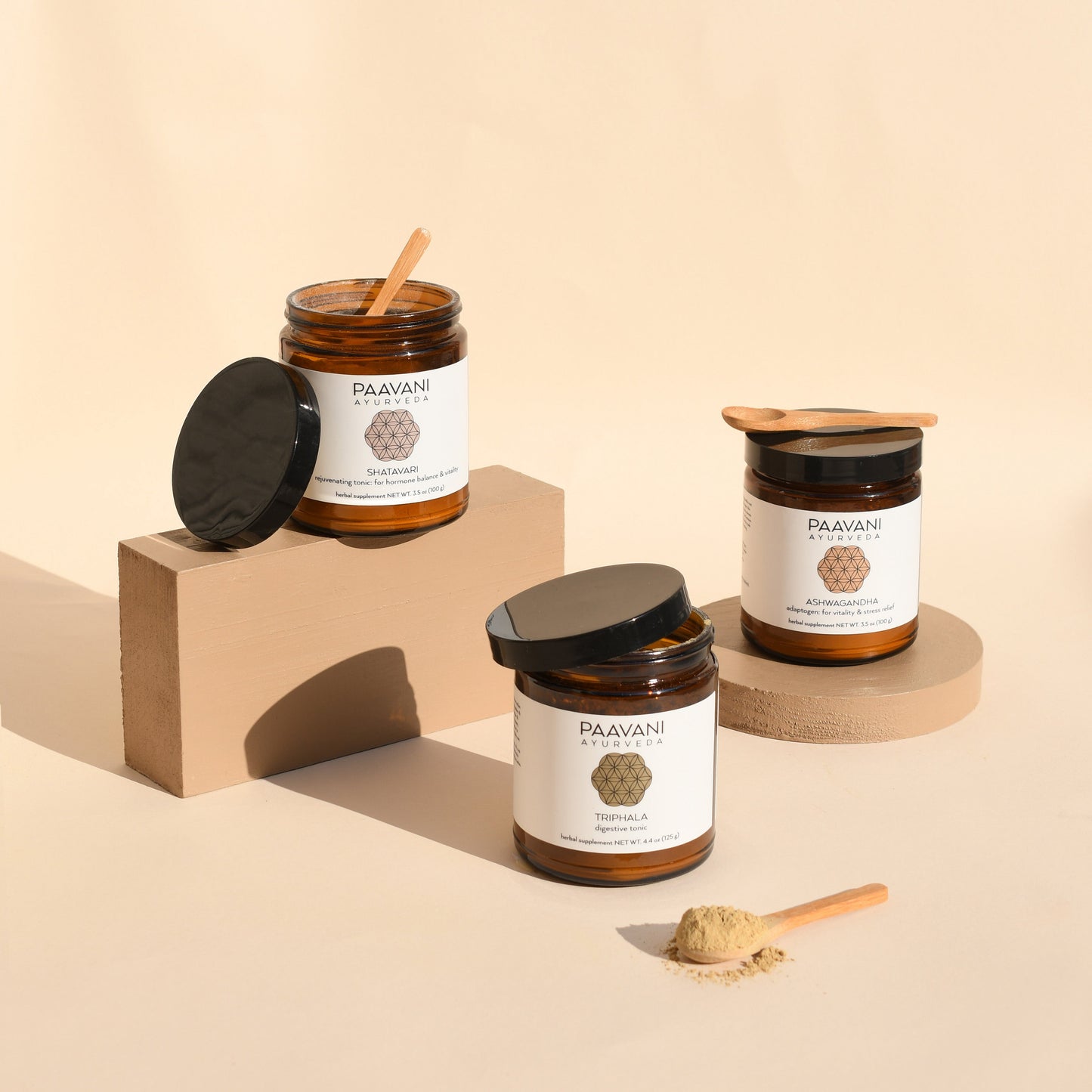 DC-PAAVANI Ayurveda Ayurvedic tonic for daily wellness in amber jars with wooden spoons and powder
