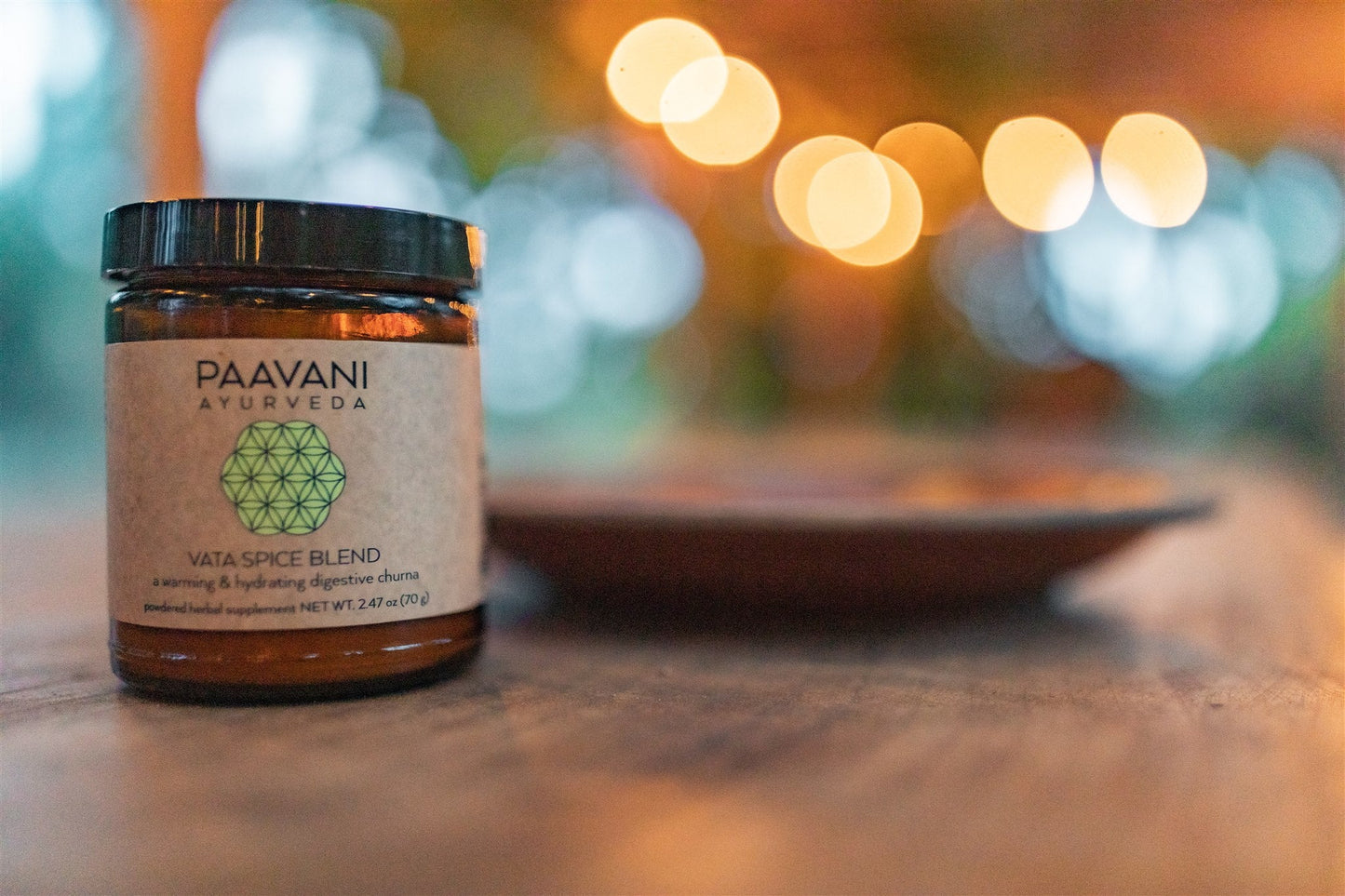 DC-PAAVANI Ayurveda Vata spice blend for digestion in amber glass jar on wooden surface