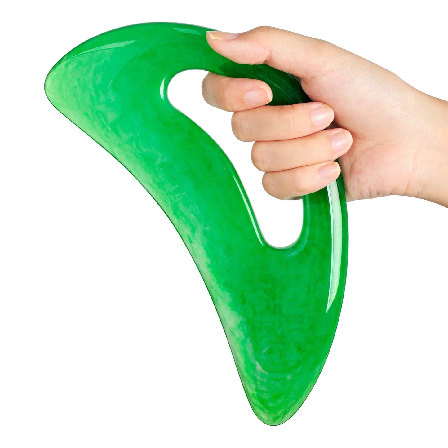 Green jade gua sha massage tool held in hand for facial and body massage by SACRED SELF WELLNESS