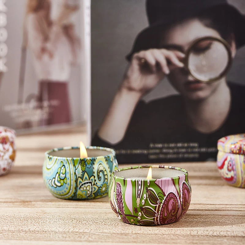 SACRED SELF WELLNESS soy scented candles gift set in decorative patterned tins lit on wooden surface