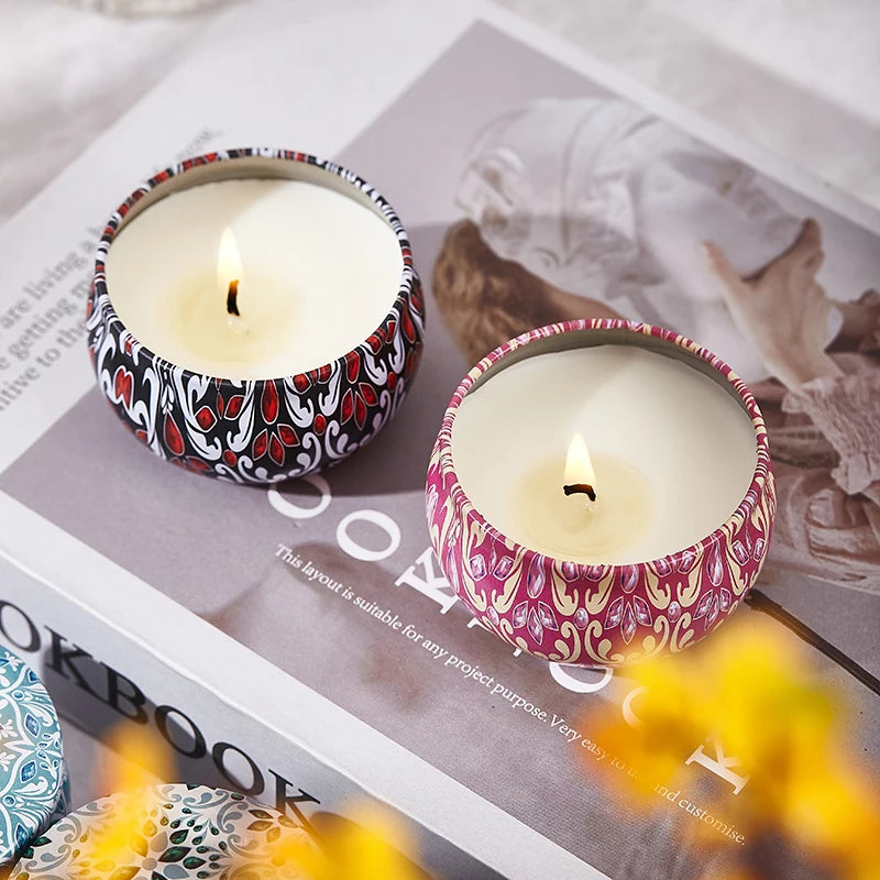 SACRED SELF WELLNESS soy scented candles gift set with two lit candles in decorative tins on a book
