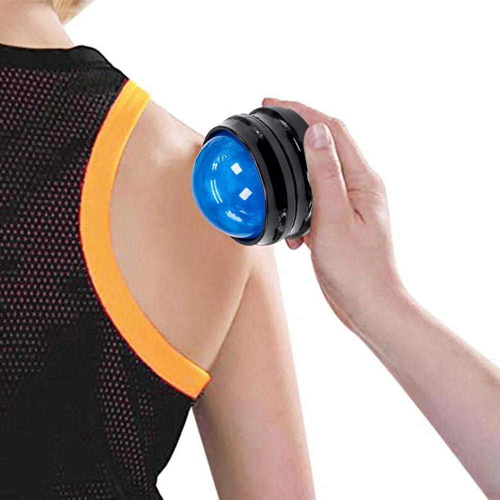 Massage roller ball for muscle relaxation being used on shoulder of person wearing black and orange tank top