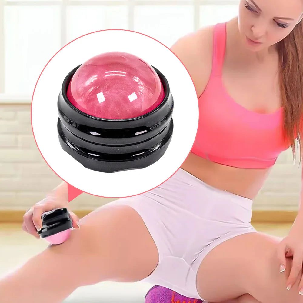 Sacred Self Wellness massage roller ball for muscle relaxation with pink stone and black base being used on thigh