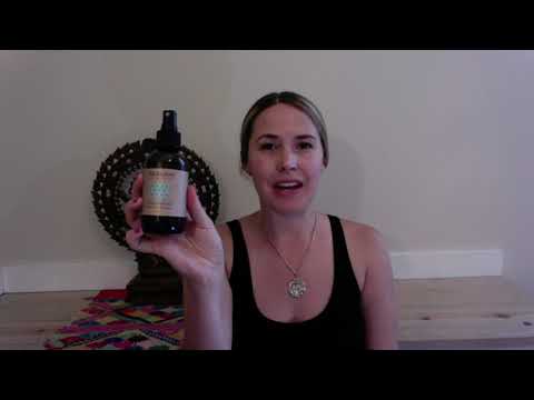 Woman holding a bottle from DC-PAAVANI Ayurveda Ayurvedic aromatherapy kit with natural ingredients