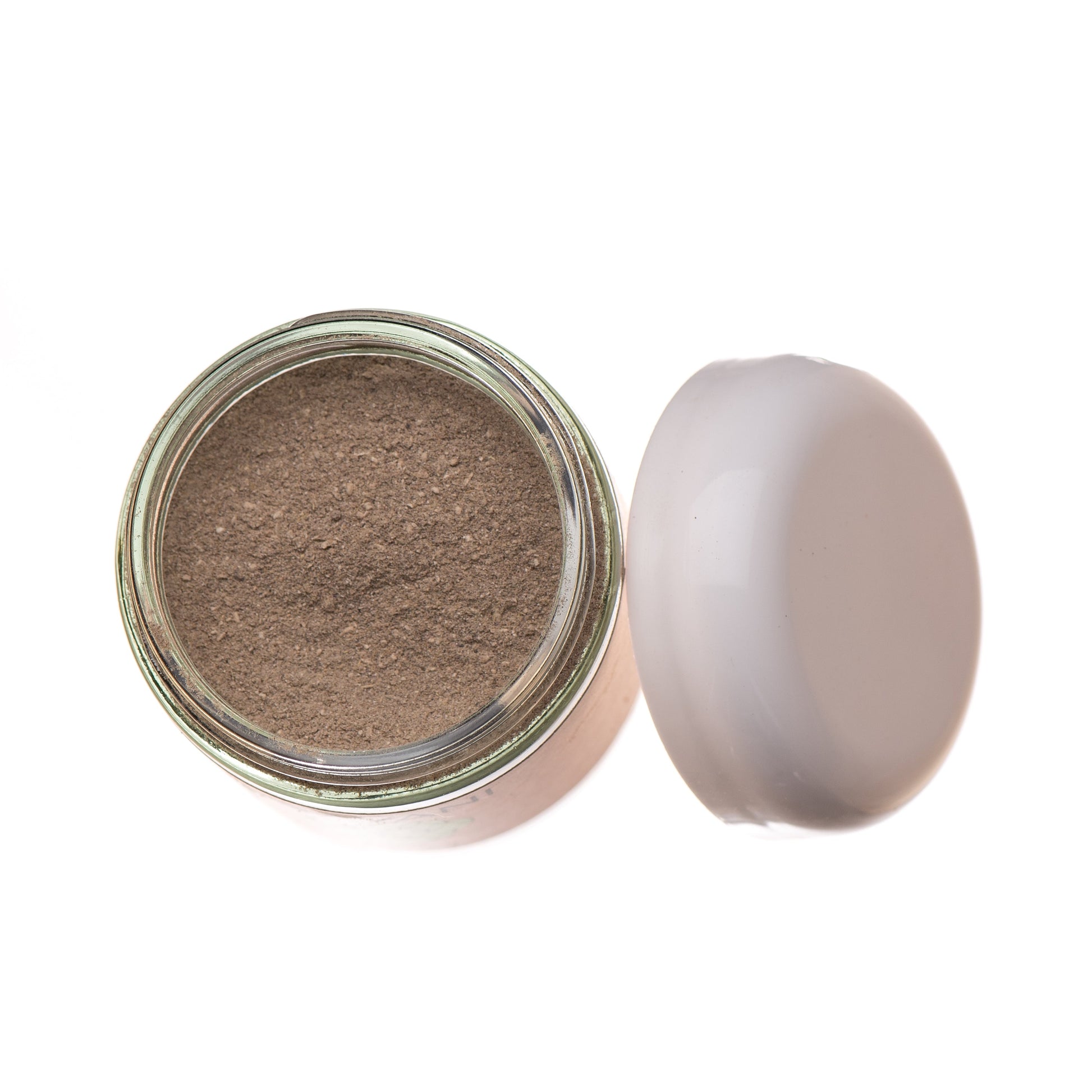 Open jar of DC-PAAVANI Ayurveda ayurvedic cleanser for dry skin with brown powder and white lid