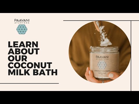 Jar of DC-PAAVANI Ayurveda Ayurvedic coconut milk bath powder being scooped with a spoon