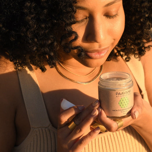 Woman holding Ayurvedic skincare cream jar from DC-PAAVANI Ayurveda for Ayurvedic skin care class