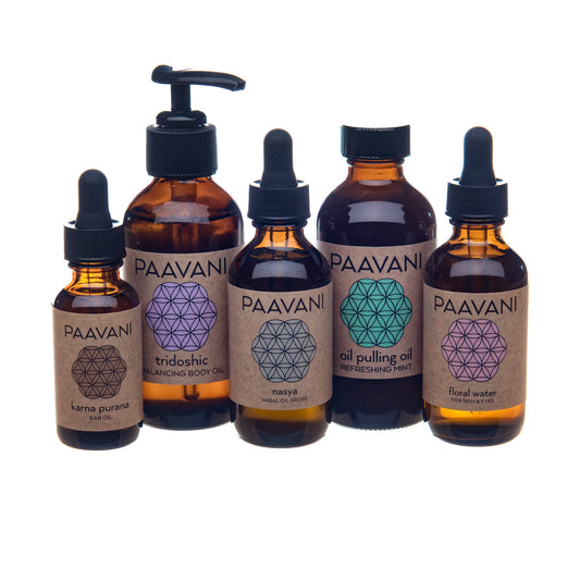 Dinacharya ritual kit for daily wellness featuring Ayurvedic oils including body oil, ear oil, nasal oil, oil pulling oil, and floral water