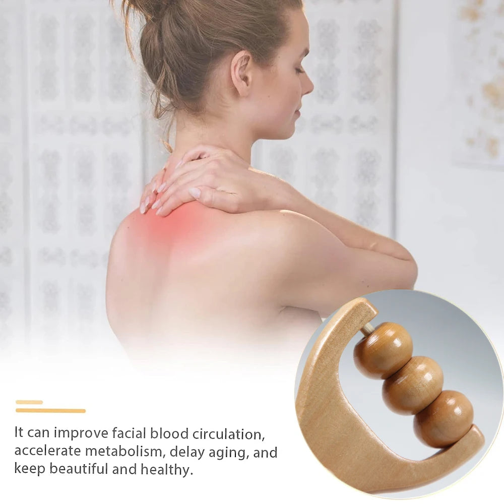 Wooden handheld massage roller from SACRED SELF WELLNESS beside woman massaging her red sore shoulder