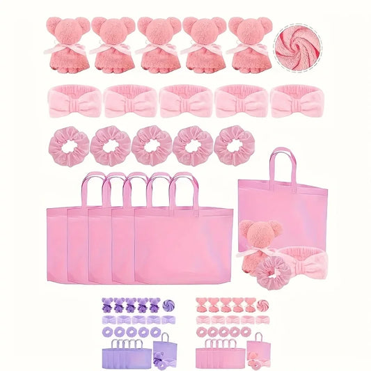 Pink spa gift set for women with soft towels, headbands, hair scrunchies, and matching gift bags